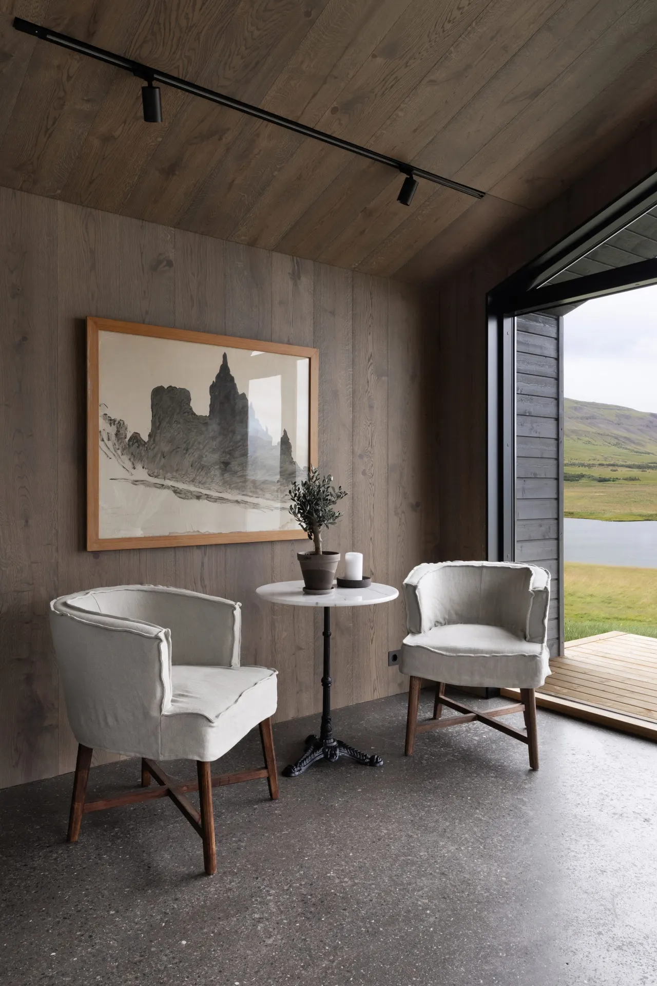 Scandinavian modern designed cabin with lakeside view and icelandic art