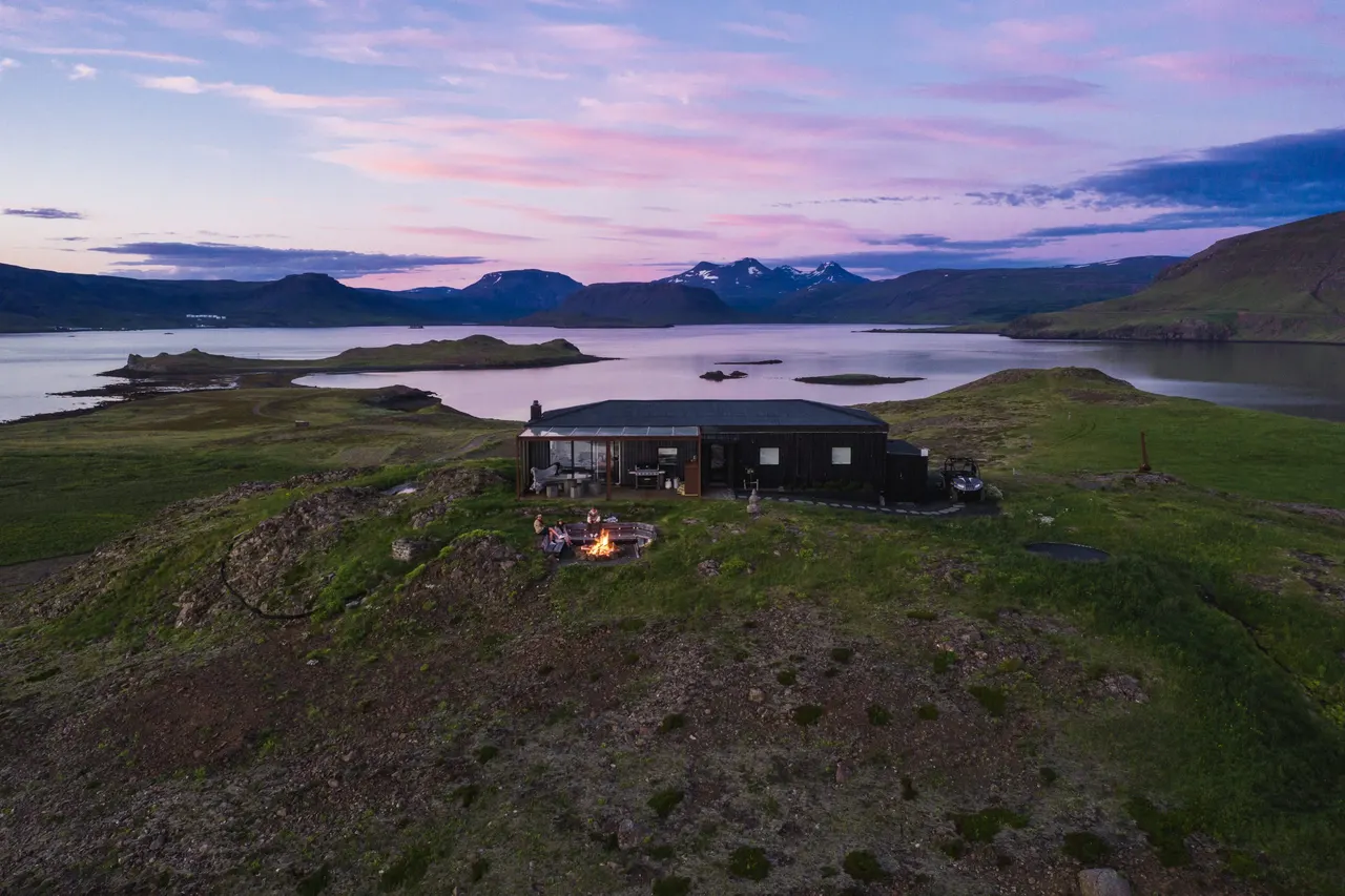 A house on top of a hill with a fire place
