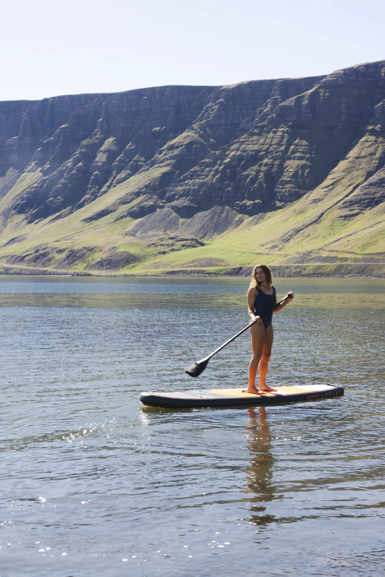 Paddle boarding in Hvalfjordur near Hvammsvik Hot Springs