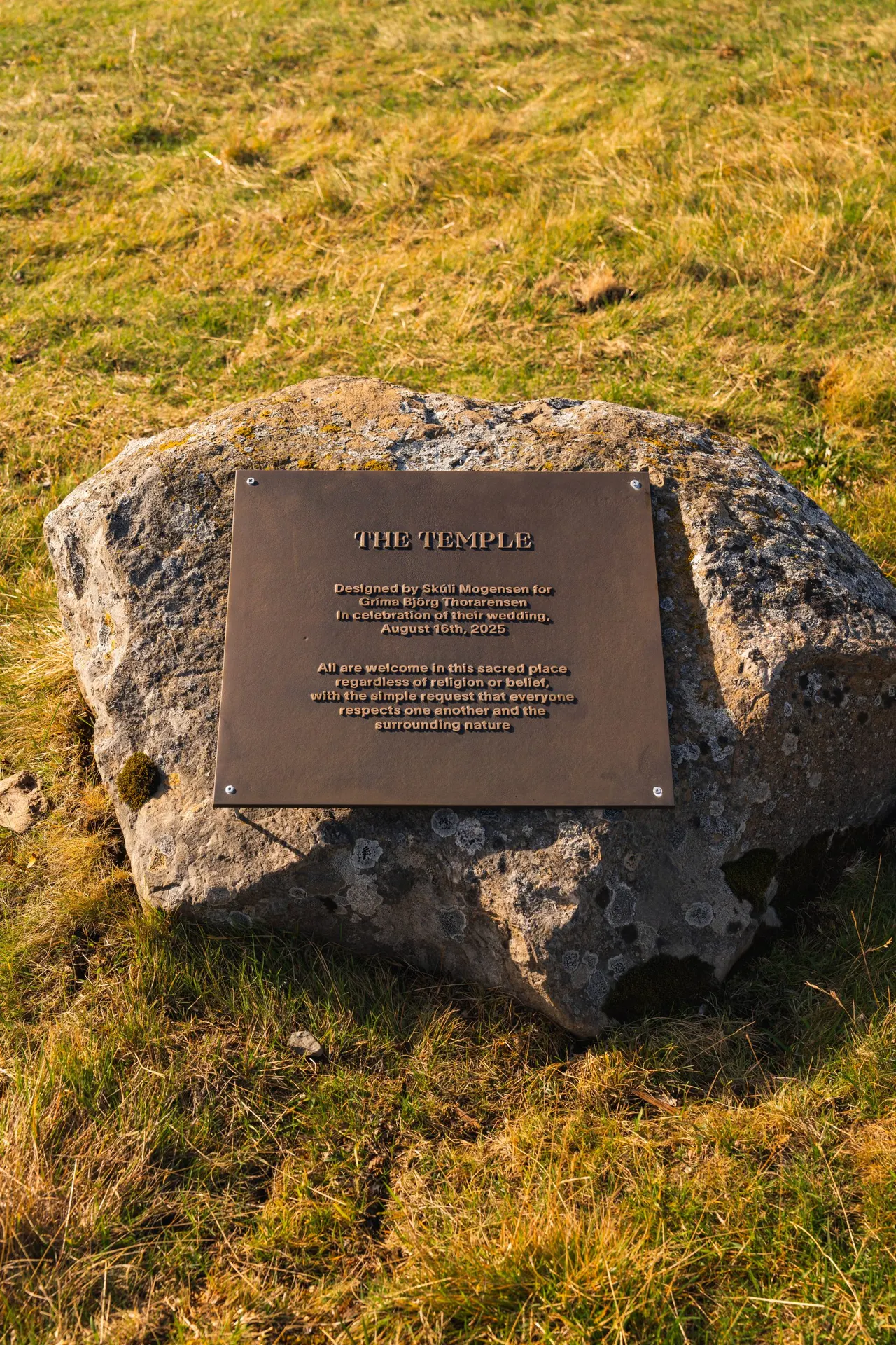 The Temple's plaque on a stone