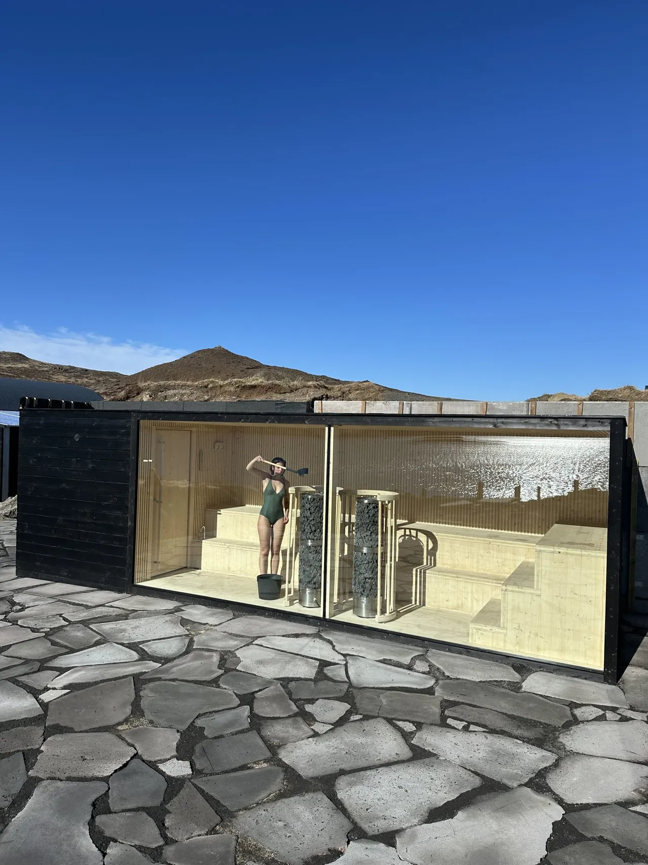 The glass-fronted sauna by the hot springs