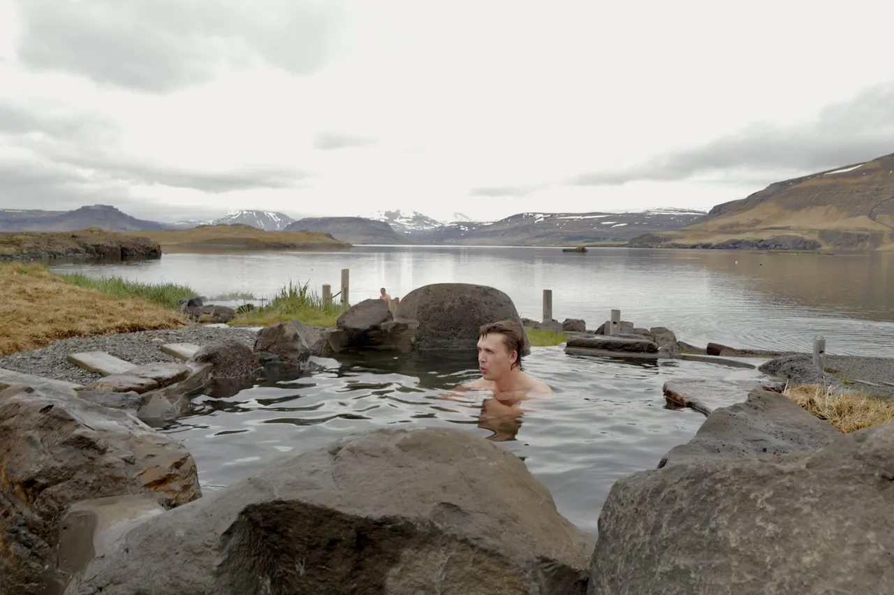Bather in the Ocean Plunge Pool by the fjord